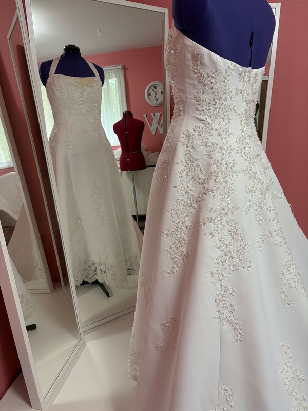 Before: the wedding gown’s beaded lace bodice and skirt, close up